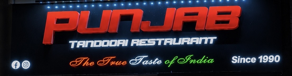 Punjab Tandoori Restaurant sign — The True Taste of India, Since 1990